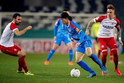 In this file photo taken on March 03, 2021 Holstein Kiel's South-Korean midfielder Lee Jae-sung (C) controls the ball during the German Cup (DFB Pokal) quarter-final football match. (Photo | AFP)