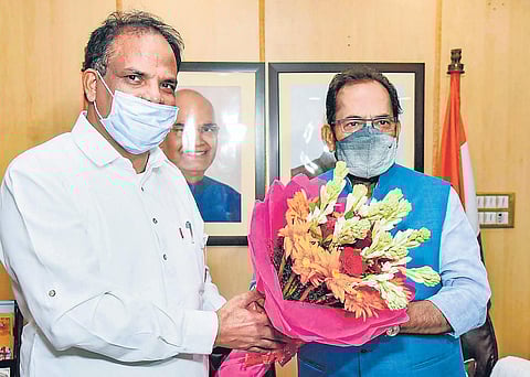 John Barla (L) greeted by Minister for Minority Affairs Mukhtar Abbas Naqvi | PTI