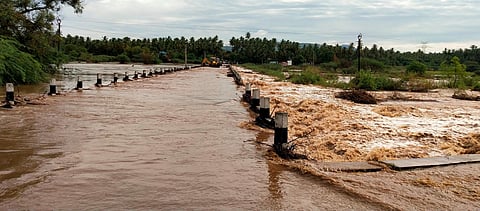 Flood waters submerged a low-level bridge in Tirupathur district thanks to overnight heavy rains (Photo | Special arrangement)