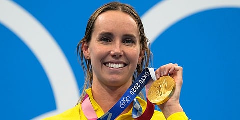 Emma Mckeon, of Australia, poses after winning the gold medal in the women's 50-meter freestyle final at the 2020 Summer Olympics in Tokyo, Japan. (Photo | AP)
