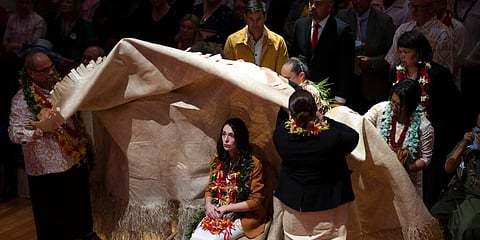 New Zealand Prime Minister Jacinda Ardern is covered during a ceremony in Auckland, August 1, 2021, to formally apologize for the country's 'Dawn Raids' on Pacific people in the 1970s. (Photo | AP)