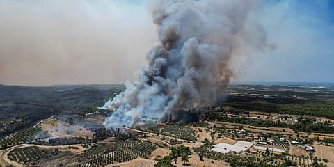An aerial photo shows wildfires in Kacarlar village near the Mediterranean coastal town of Manavgat, Antalya, Turkey, Saturday, July 31, 2021. (Photo | AP)
