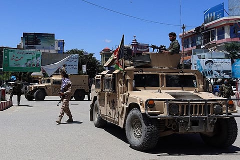 Afghan security forces sit in a Humvee vehicle amid ongoing fighting between Taliban militants and Afghan security forces in Kunduz. (File Photo | AFP)