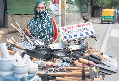 Munni Lohar at stall, now well-stocked with iron equipments and kitchen utensils. (Photo | EPS)