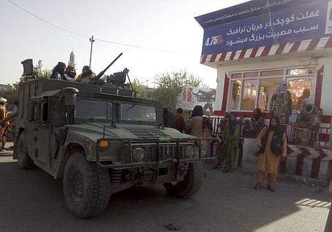 Taliban fighters stand guard at a checkpoint in Kunduz city, northern Afghanistan, Monday, Aug. 9, 2021. (Photo | AP)