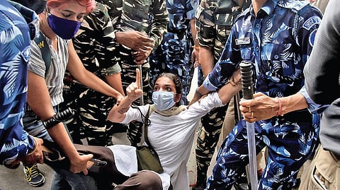 A student being detained for participating in a protest against hate speech at Parliament Street, Jan, 2024.