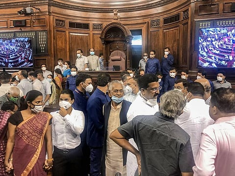 MPs protest inside the Rajya Sabha during the Monsoon Session of Parliament, in New Delhi. (Photo | Twitter)