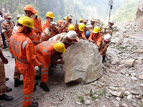 This photograph provided by India's National Disaster Response Force (NDRF) shows NDRF soldiers working on a rescue operation at the site of a landslide in Kinnaur district in Himachal. (Photo | AP)