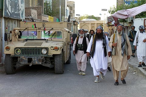 Private militia loyal to Ismail Khan, the former Mujahideen commander patrols after security forces took back control of parts of Herat city. (Photo | AP)