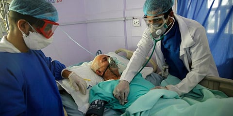 In this June 14, 2020, file photo, medical workers attend to a COVID-19 patient in an intensive care unit at a hospital in Sanaa, Yemen. (Photo | AP)