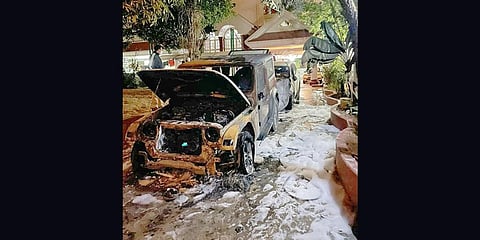 The charred remains of two cars that were set afire by miscreants at Bommanhalli MLA Satish Reddy’s residence in Bengaluru on Thursday.
