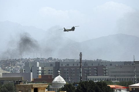 A U.S. Chinook helicopter flies over the city of Kabul, Afghanistan. (Photo | AP)