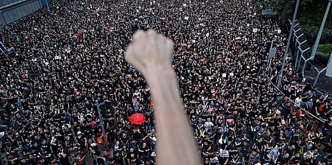 In this June 16, 2019, file photo, protesters march on the streets against an extradition bill organized by Civil Human Right Front in Hong Kong. (File photo | AP)