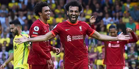Liverpool's Mohamed Salah celebrates after scoring his side's third goal during the EPL match between Norwich City and Liverpool at Carrow Road Stadium in Norwich. (Photo | AP)