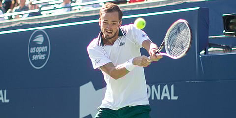 Daniil Medvedev hits a backhand return during his win over Reilly Opelka in National Bank Open men's doubles final action in Toronto. (Photo | AP)