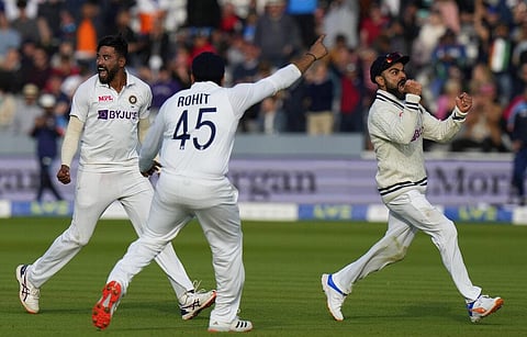 India's Mdohammed Siraj, left celebrates with India's Virat Kohli, right after taking the wicket of England's Jos Buttler. (Photo | AP)