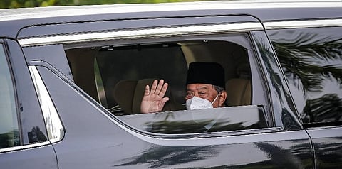 Malaysia's Prime Minister Muhyiddin Yassin waves as he arrives at the National Palace in Kuala Lumpur on August 16, 2021, as he was expected to quit after just 17 months in office. (Photo | AP)