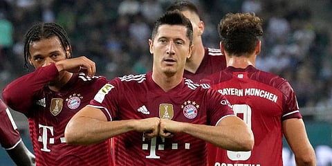 Robert Lewandowski reacts after scoring during the German Bundesliga soccer match between Borussia Moenchengladbach and Bayern Munich in Moenchengladbach. (Photo | AP)