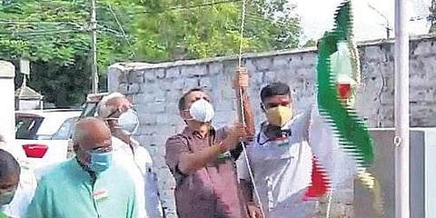 A video grab of BJP state president K Surendran hoisting the Tricolour upside down at the party office in Thiruvananthapuram. (Photo| Screengrab)