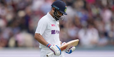 India's Virat Kohli walks from the pitch after being given out caught behind off the bowling of England's Sam Curran during the fourth day of the second Test at Lord's cricket ground.