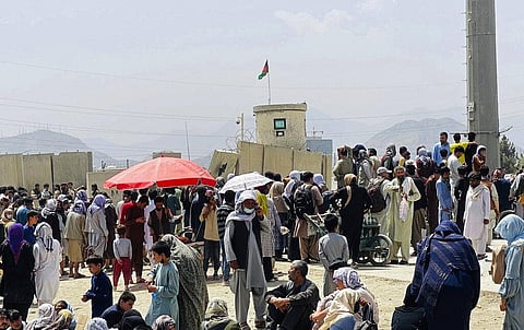 Hundreds of people gather outside the international airport in Kabul, Afghanistan, Tuesday, Aug. 17, 2021. (Photo | AP)