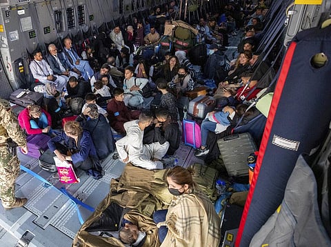 People sit in a German Bundeswehr airplane at the airport in Kabul. (Photo | AP)