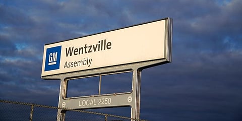 A sign stands near an entrance to a General Motors assembly plant in Wentzville. (Photo | AP)