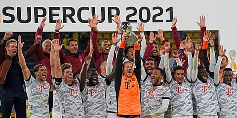 Victorious Bayern Munich players with the German Super Cup. (Photo | AP)