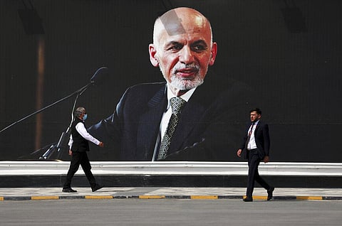 A mural of Afghan President Ashraf Ghani hangs at Hamid Karzai International Airport, in Kabul. (Photo| AP)