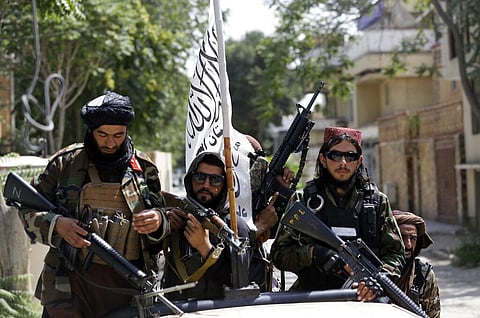 Taliban fighters display their flag on patrol in Kabul, Afghanistan, Thursday, Aug. 19, 2021. (Photo | AP)
