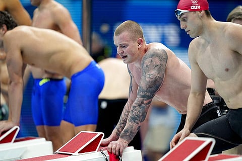 Britain's Adam Peaty, left, and James Guy look on after their team finished second in the mixed 4x100-meter medley relay. (Photo | AP)