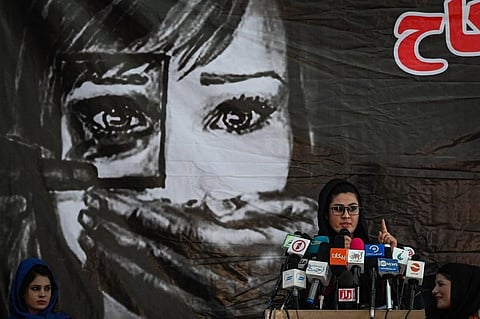 A social worker address the Afghan women gathered at a hall in Kabul on August 2, 2021 against the claimed human rights violations on women by the Taliban regime in Afghanistan. (Photo | AFP)