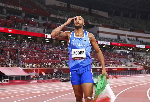 Lamont Marcell Jacobs of Italy celebrates after winning the final of the men's 100-meters at the 2020 Summer Olympics. (Photo | AP)