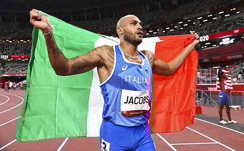 Lamont Marcell Jacobs of Italy celebrates after winning the final of the men's 100-meters at the 2020 Summer Olympics. (Photo | AP)