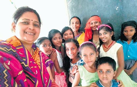 English teacher Chandana Dutt with her pupils at the school in Madhubani | Express