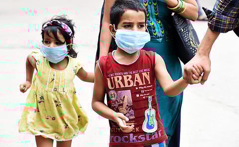 Children with mask seen walking with parents amid rise in covid 19 case in Bengaluru.