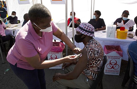 A person receives a Johnson & Johnson vaccine at a pop-up vaccination centre, at the Bare taxi rank in Soweto, South Africa. (Photo | AP)