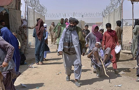 Afghan people enter into Pakistan through a border crossing point, in Chaman, Pakistan, Friday, Aug. 20, 2021. (Photo | AP)
