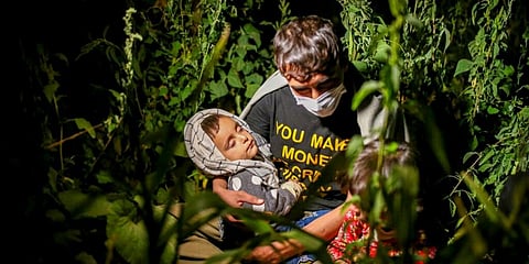 Afghan migrants sit in the countryside in Tatvan, in Bitlis Province, eastern Turkey. (Photo | AP)
