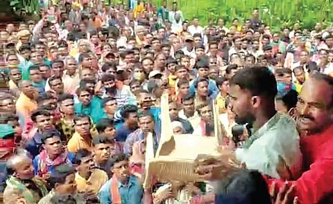 Farmers gather at the LAMPS office in Jharigam on Friday. (Photo | Express)