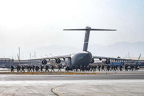 Soldiers, assigned to the 82nd Airborne Division, arrive to provide security in support of Operation Allies Refuge at Hamid Karzai International Airport. (Photo | AP)