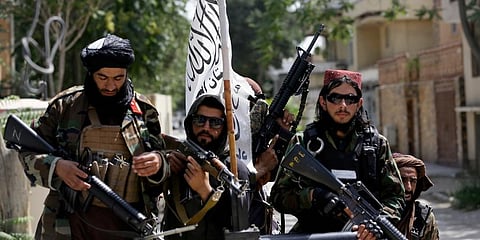 , Taliban fighters display their flag on patrol in Kabul, Afghanistan. (Photo | AP)