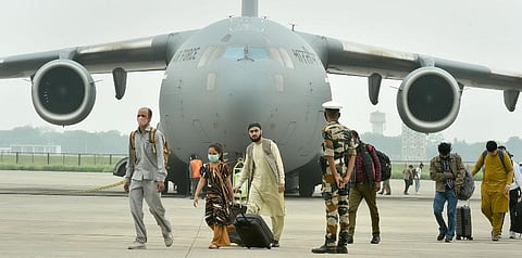 People who were stranded in crisis-hit Afghanistan arrive by a special repatriation flight of IAF at the Hindan Air Force Station, in Ghaziabad, Sunday, Aug. 22, 2021. (Photo | PTI)
