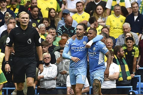 Manchester City's Jack Grealish with teammate Gabriel Jesus celebrates after scoring his side's second goal during the English Premier League soccer match. (Photo | AP)