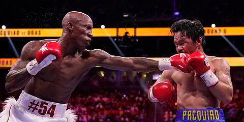 Yordenis Ugas, of Cuba, hits Manny Pacquiao, of the Philippines, in a welterweight championship boxing match in Las Vegas. (Photo | AP)