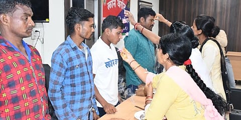 Women tying rakhi on the wrist of surrendered Maoists in Chhattisgarh on Sunday. (Photo | Express)