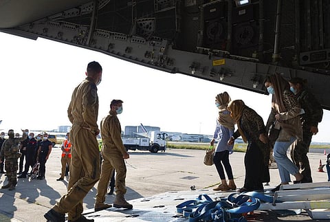 Afghan refugees arriving in a military plane at Roissy airport, north of Paris, Wednesday, Aug.25, 2021. (Photo | AP)