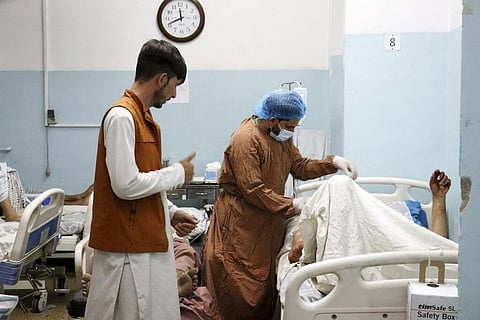 A victim receives medical assistance in a hospital after he was wounded in the deadly attacks outside the airport in Kabul, Afghanistan. (Photo | AP)