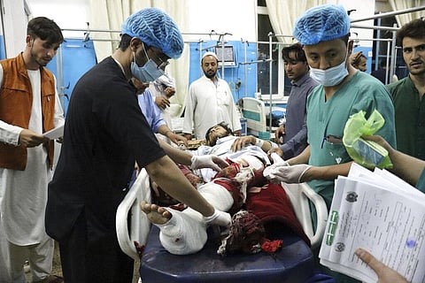 A victim receives medical assistance in a hospital after he was wounded in the deadly attacks outside the airport in Kabul, Afghanistan. (Photo | AP)