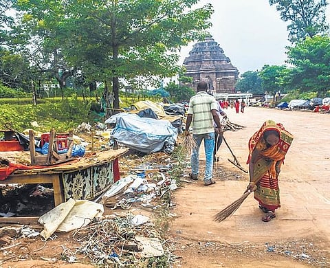 Debris of handicraft shops within the prohibited zone of Sun temple being cleared. (Photo| Biswanath Swain, EPS